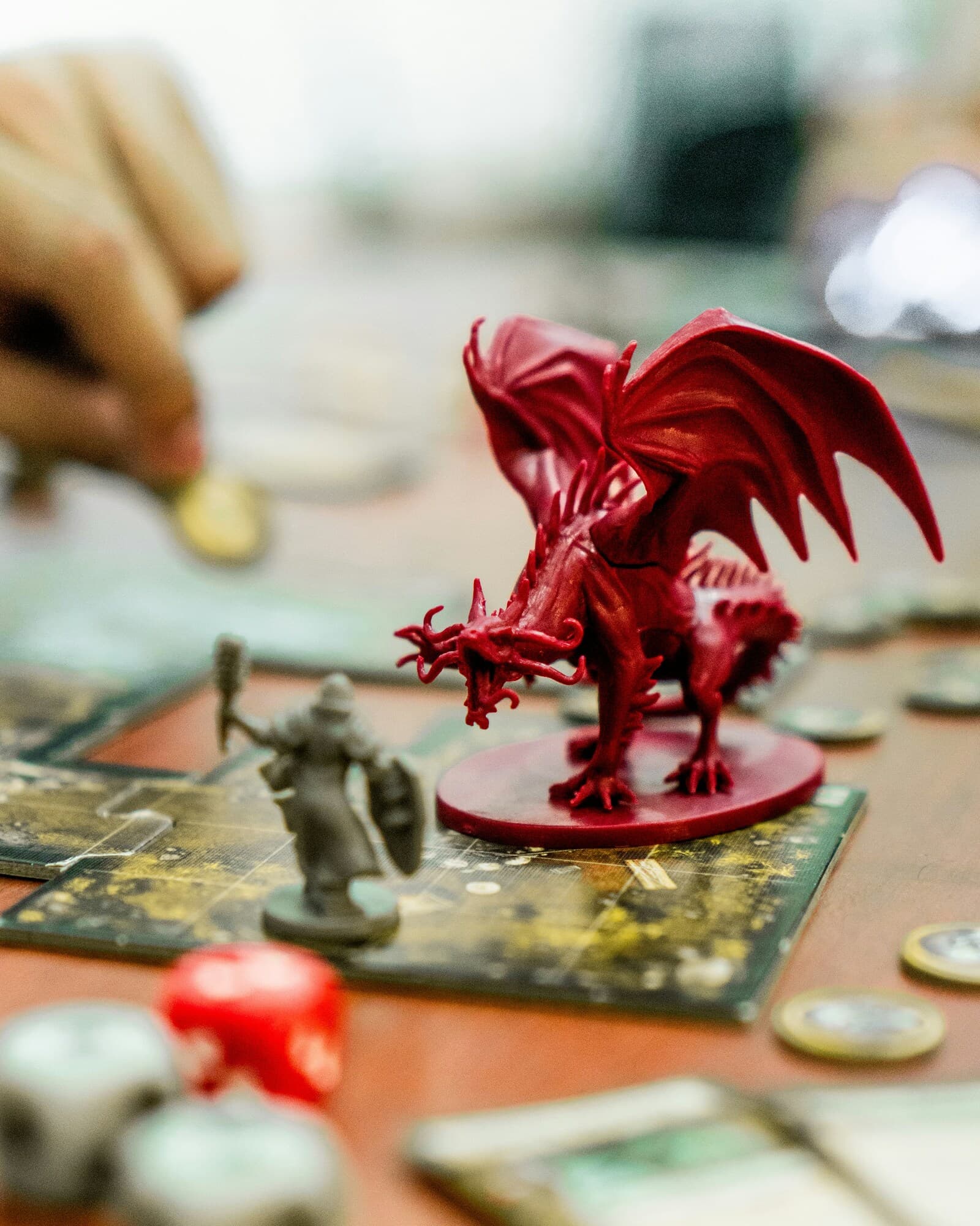 Dragon on game board attacking figure