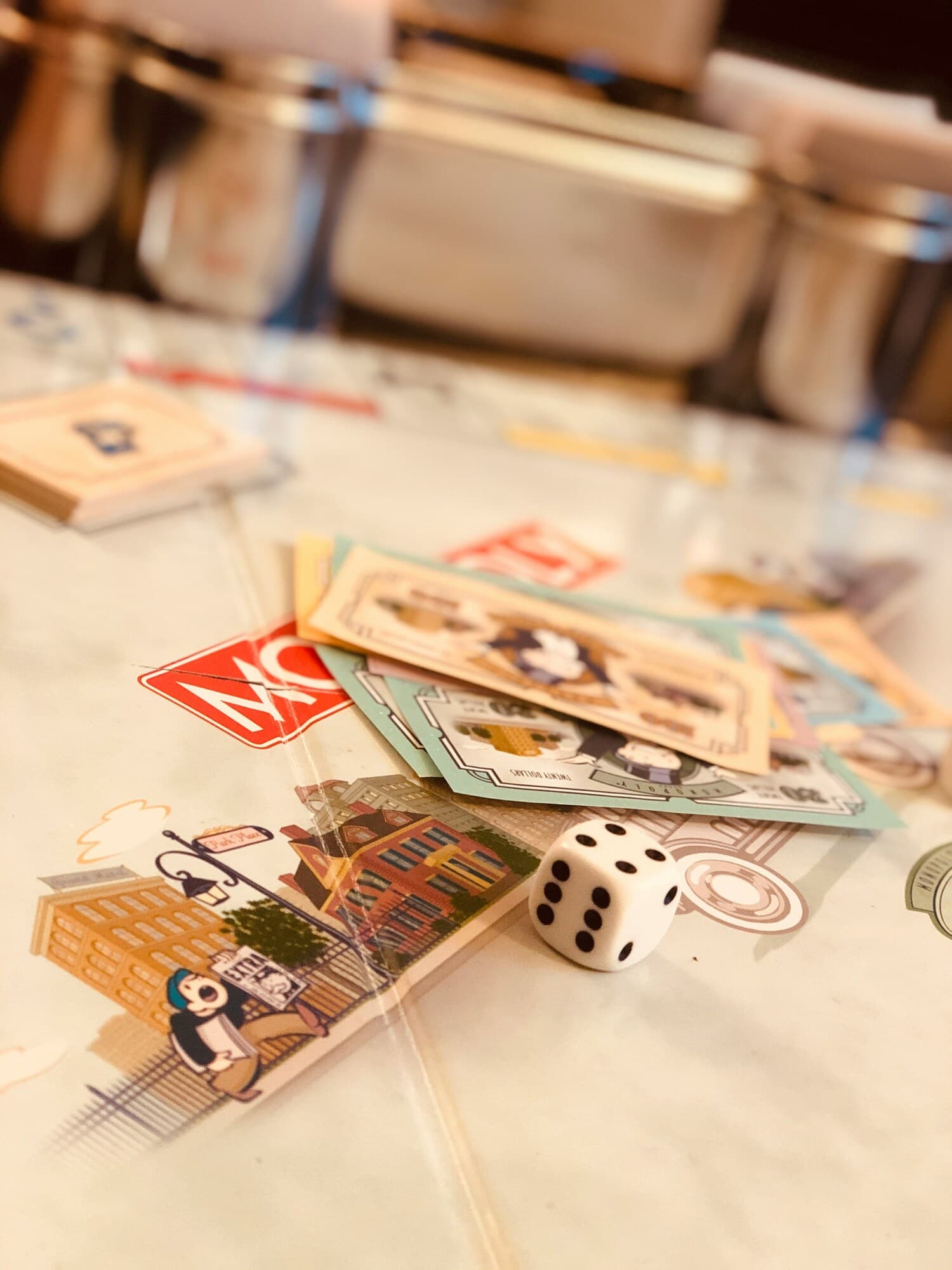 Monopoly board with dice and money
